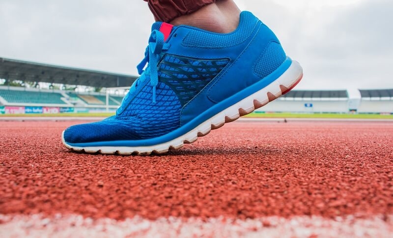 Close-up on sport shoe on running track