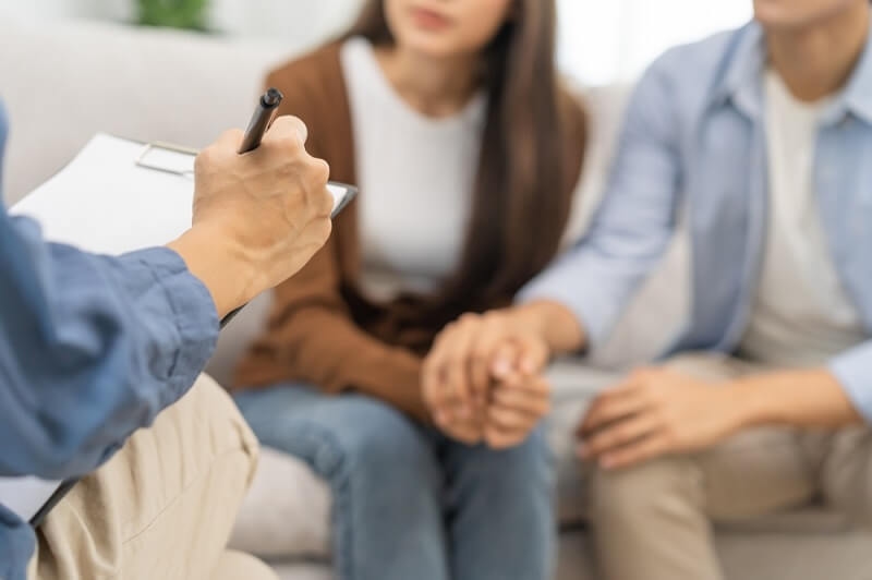 Couple consulting mental health problem with psychologist