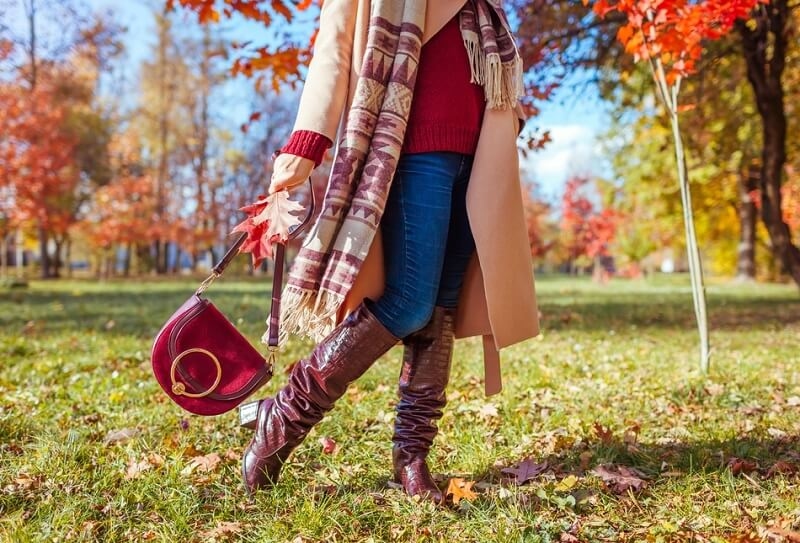 Fashionable woman wearing stylish clothes and knee high boots