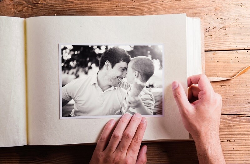 Fathers day composition. Photo album, black-and-white pictures.