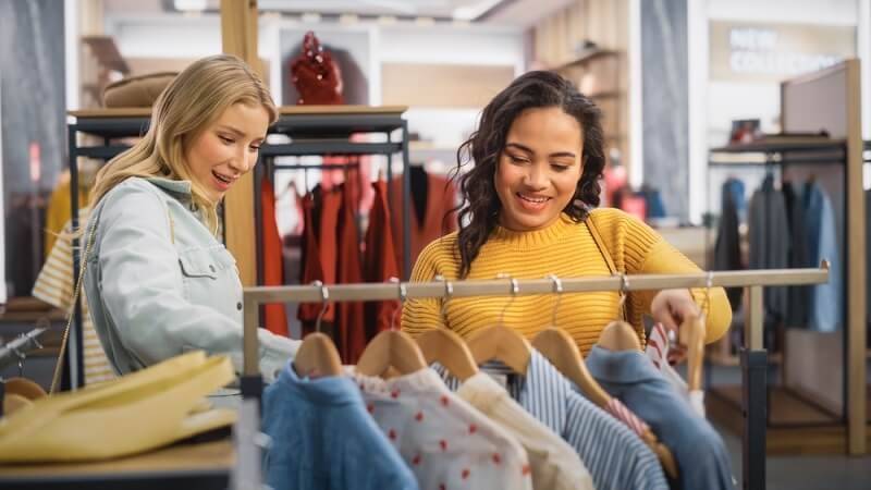 Female Friends Shopping in Clothing Store