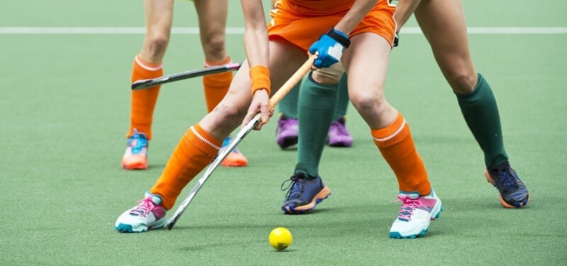 Hockey Player passing the ball