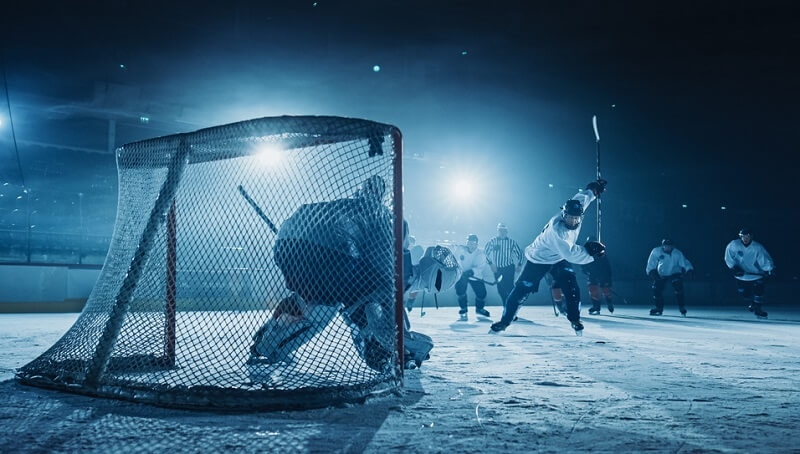 Ice Hockey Game in Rink Arena Forward Player doing Slapshot