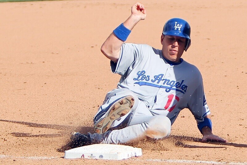 Los Angeles Dodgers catcher A. J. Ellis slides into third base