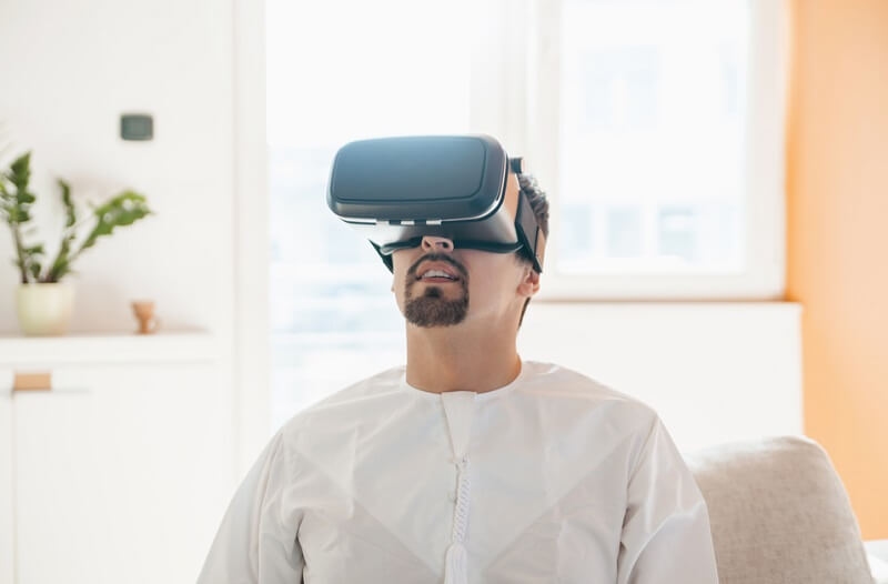 Man Using VR Headset At Home