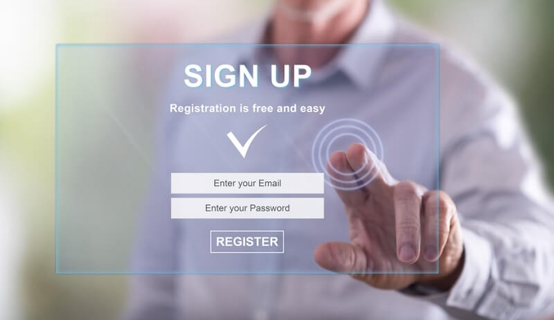 Man touching a signup concept on a touch screen with his finger