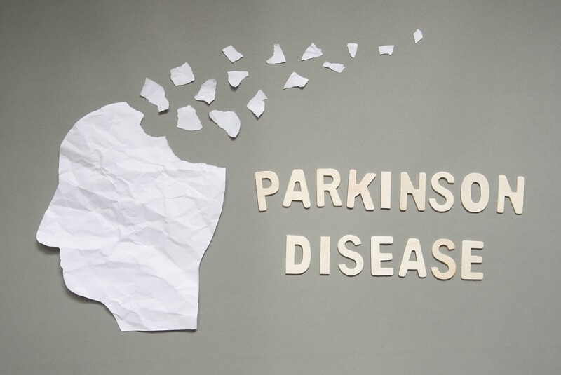 Parkinson's disease concept presented by human head made form white crumpled paper