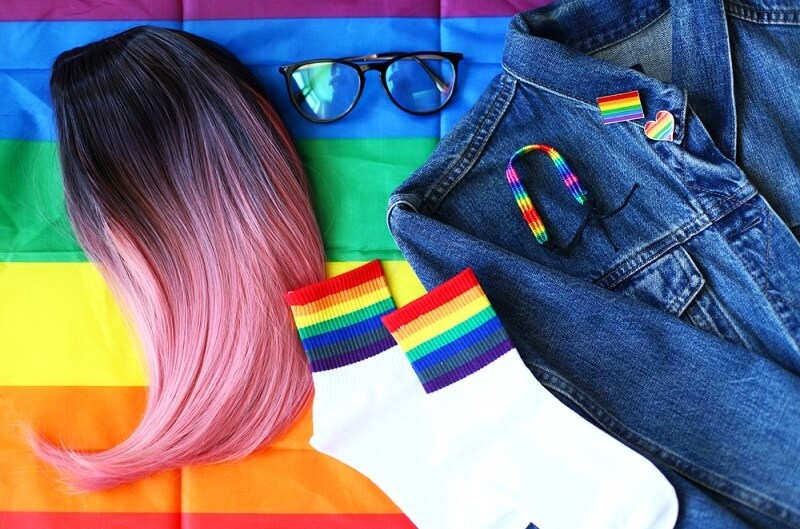 Pride Accessories, wig, glasses, LGBT flag and badges, jeans, socks. Lgbt aesthetic image