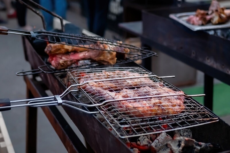 Process of grilling chicken drumsticks in grill basket