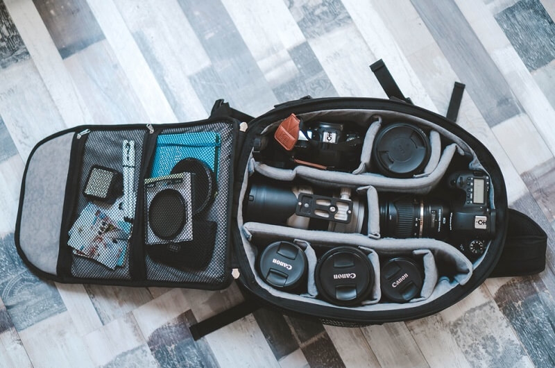 Shot of camera bag with camera, lenses and accessories