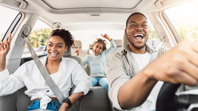 Summer Road Trip. Happy Family Of Three Riding Car And Singing