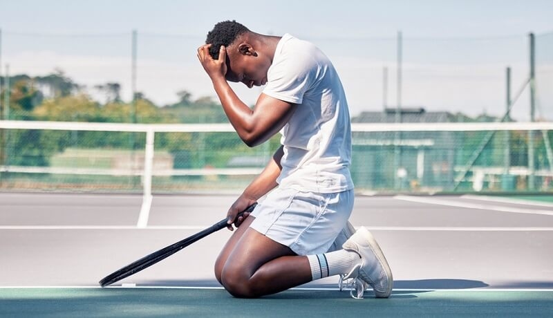 Tennis Athlete sad upset about mistakes in game