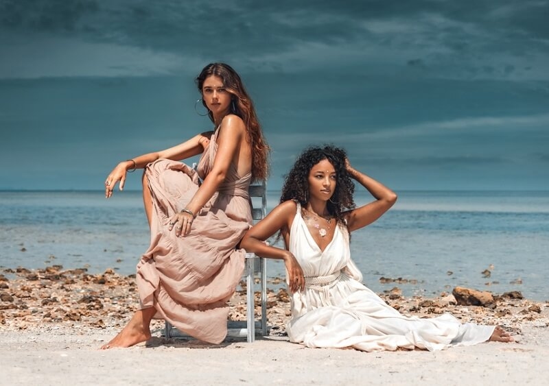 Two girls weading bohemian aesthetic dress in beach