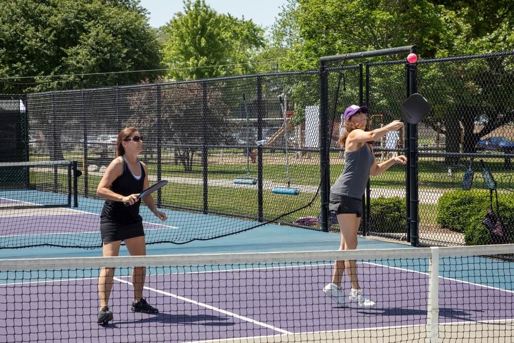 Two pickleball players in active wear