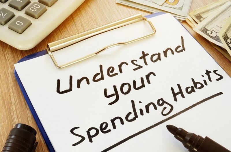 Understand your spending habits written on a clipboard