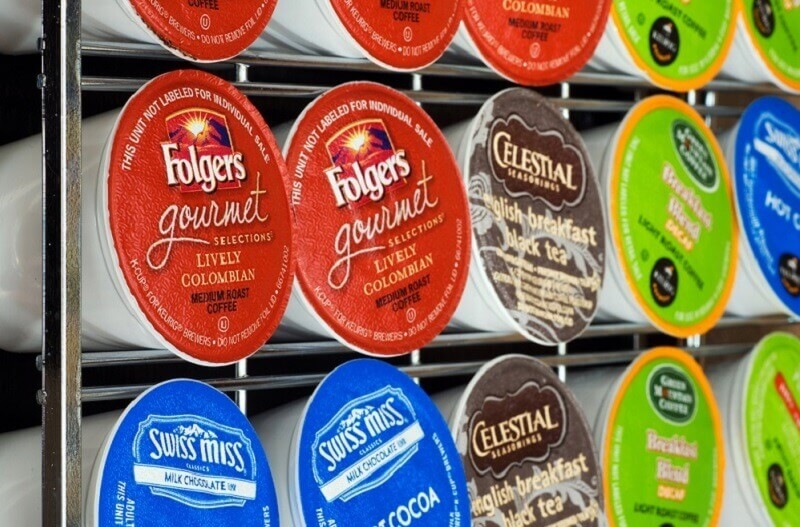 Variety of K-cup flavors on a storage rack to be used in a Keurig single serve beverage maker