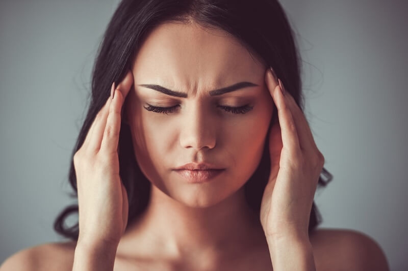 Woman suffering from Headaches