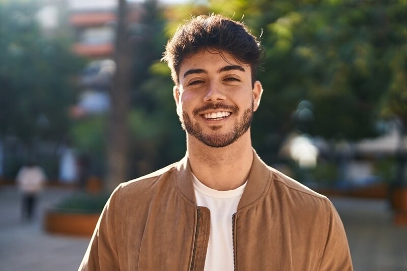 Young Hispanic man smiling