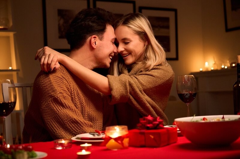 affectionate couple hugging having a date night