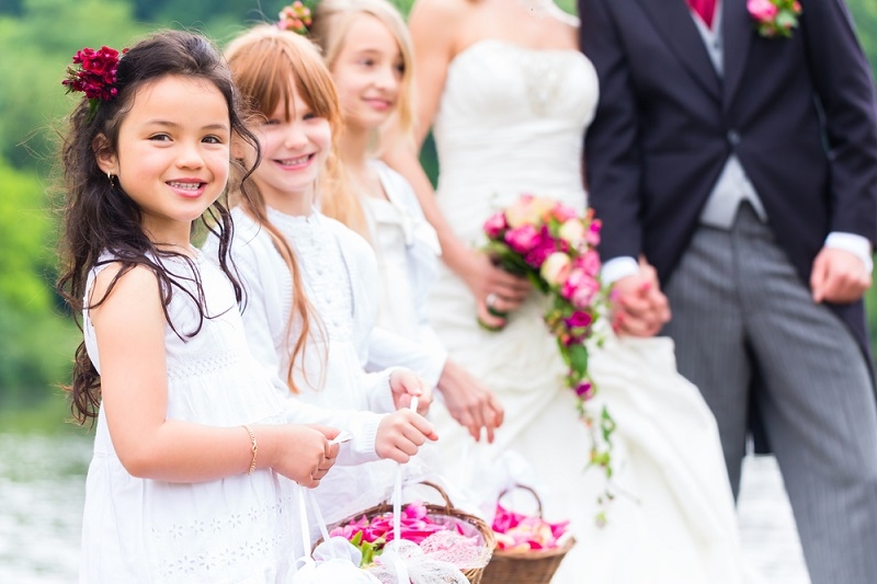 bride and groom with flower children