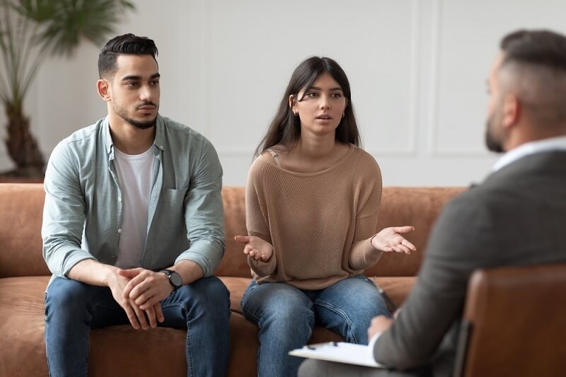 couple counseling having conversation about problem at therapy session