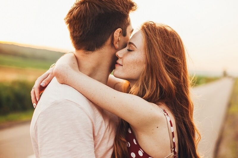 couple hugging each other while standing outdoor