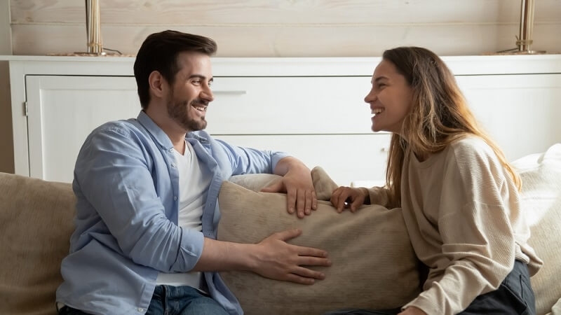 couple talking having cheerful conversation