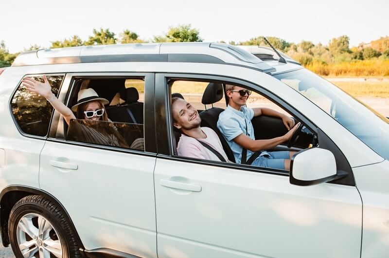 friends in car looking from the window