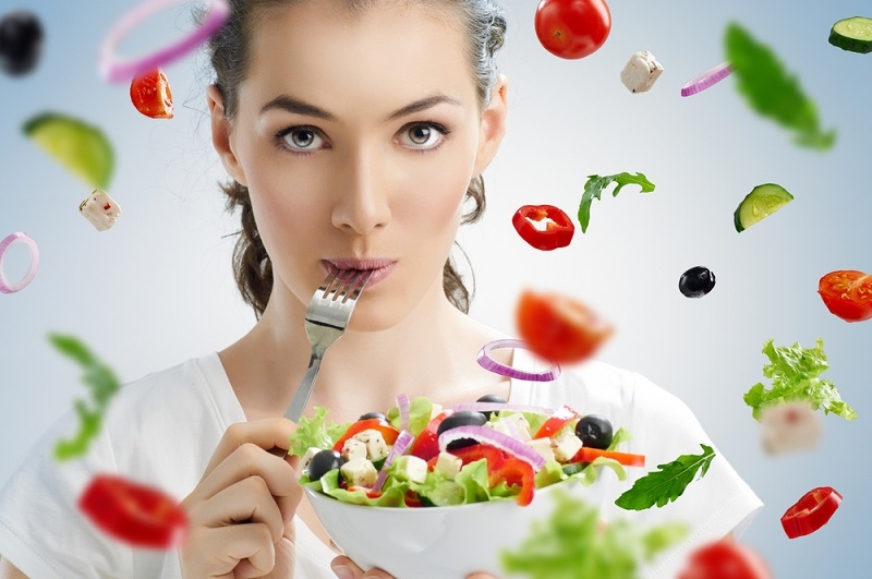 beautiful girl eating healthy food