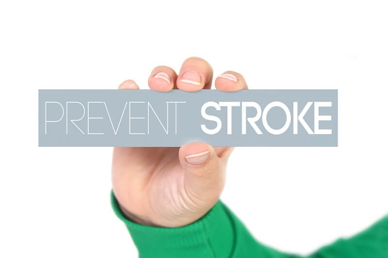 hand holding a label with prevent stroke