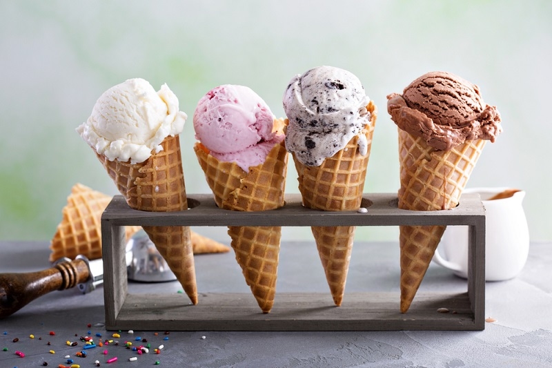 Variety of ice cream scoops in cones 