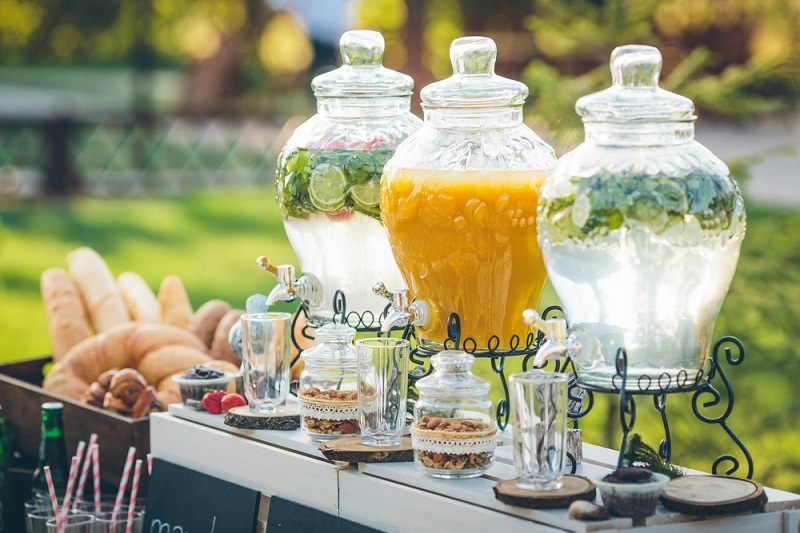 Glass jars of lemonade on wedding candy bar