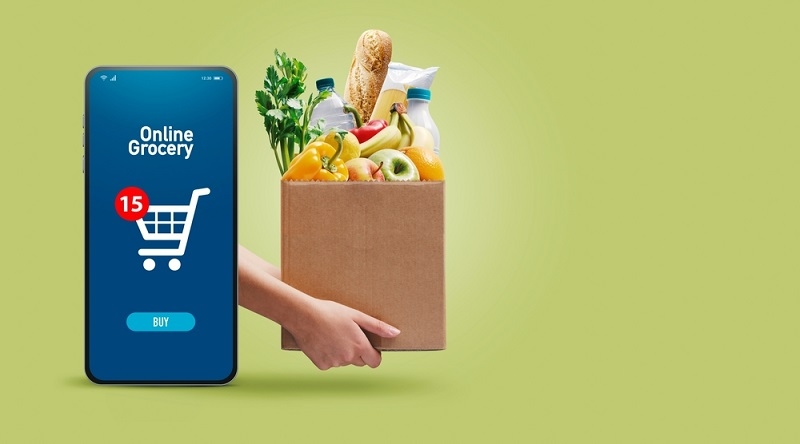 box full of fresh groceries and online grocery shopping app