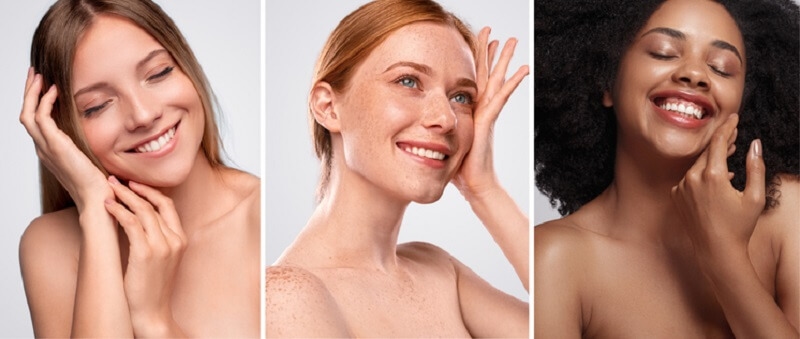 portraits of ladies with different skin types smiling