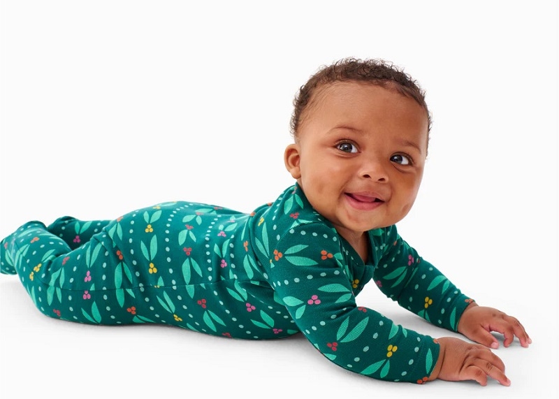 Smiling baby wearing romper