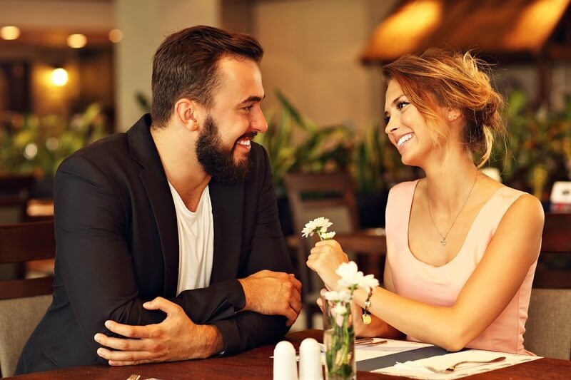 romantic couple dating in restaurant