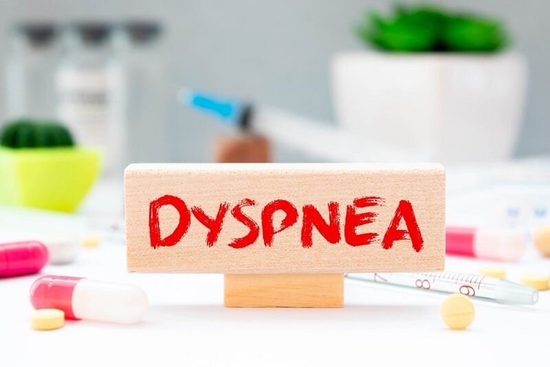 text DYSPNEA is written on wooden block