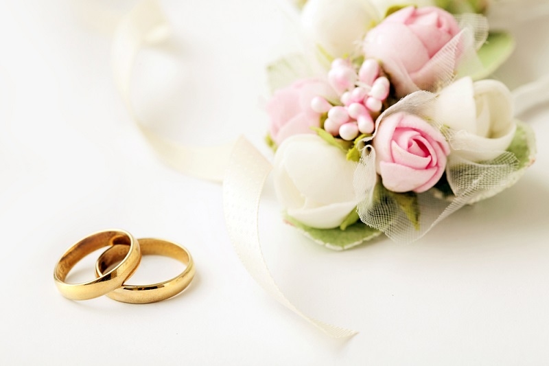 wedding rings and flowers