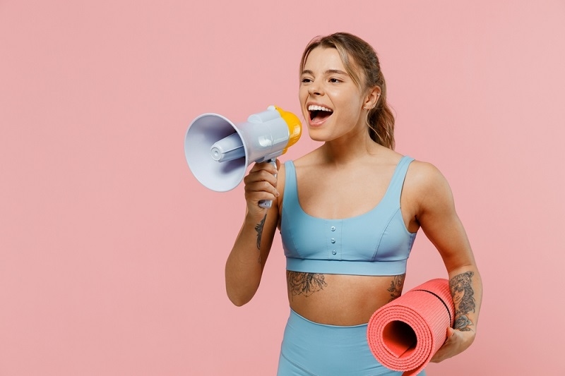 woman holding megaphone announcing sale 