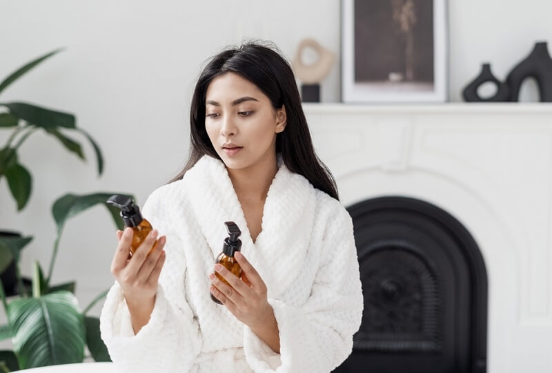 woman choosing skincare products