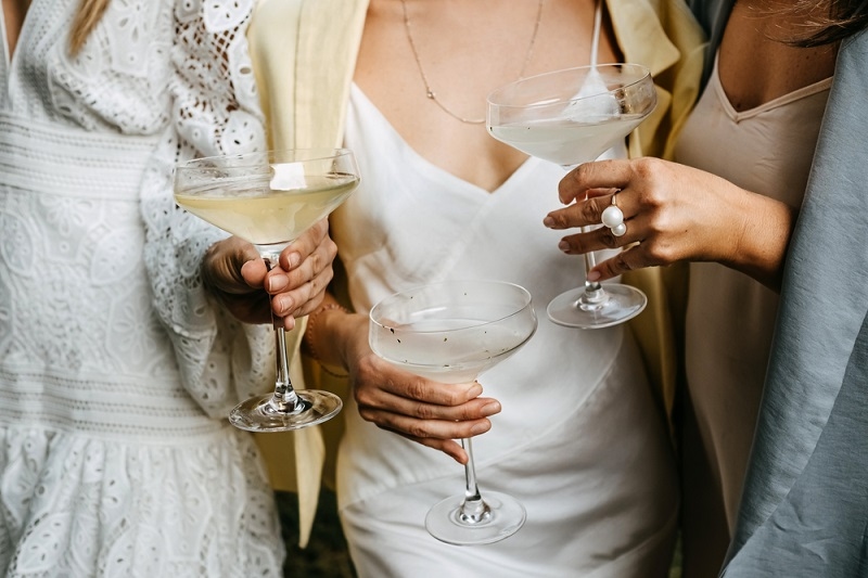 Women wearing white dresses at a wedding party