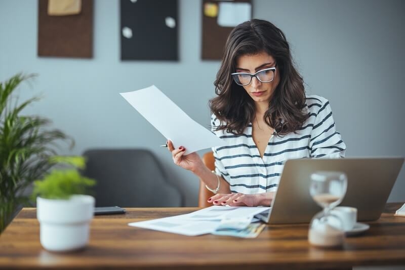 woman managing the account's finances documents