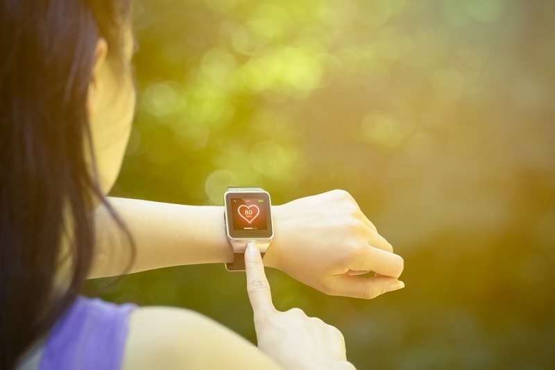 Woman using fitness tracker