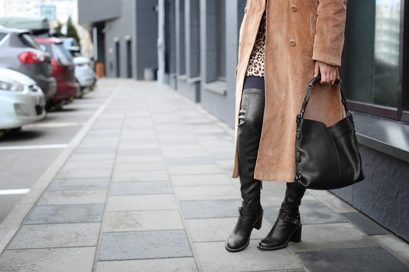 Stylish woman in black shoes on city street