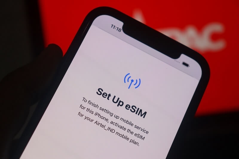 man activating and eSIM on his smartphone