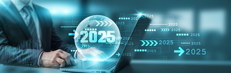 A businessman using a laptop with a futuristic digital backdrop featuring the year 2025 and advanced technology graphics. Represents innovation, business strategy.