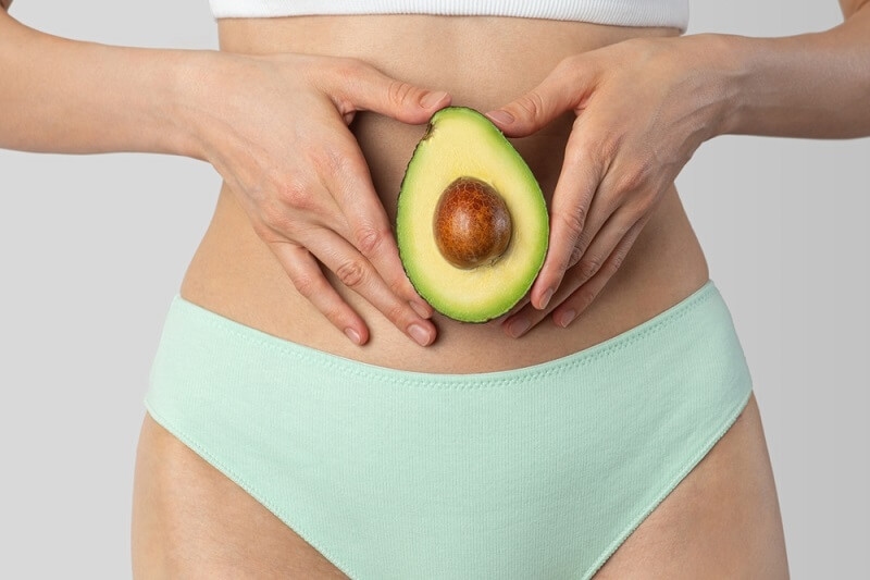avacado holded by woman