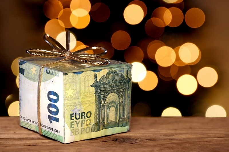 One hundred euro banknotes in transparent gift box