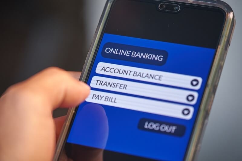 man using features of online banking in smartphone