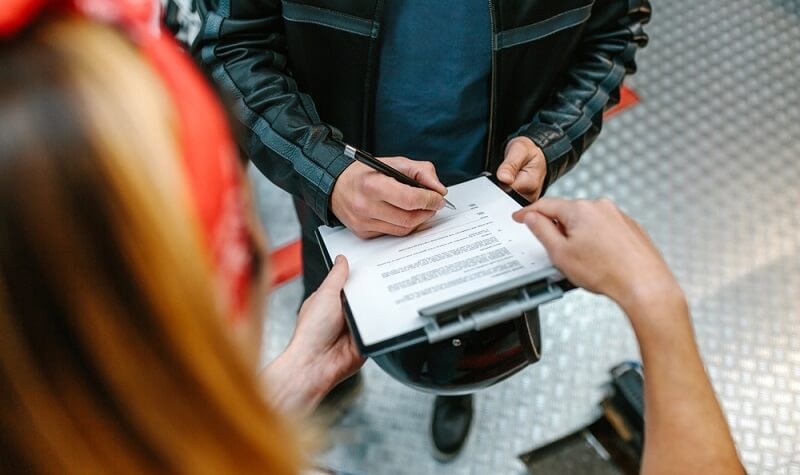 bikers signing on add ons on insurance policy